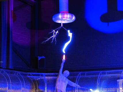 person holding electricity rod, flash, tesla coil, experiment HD wallpaper