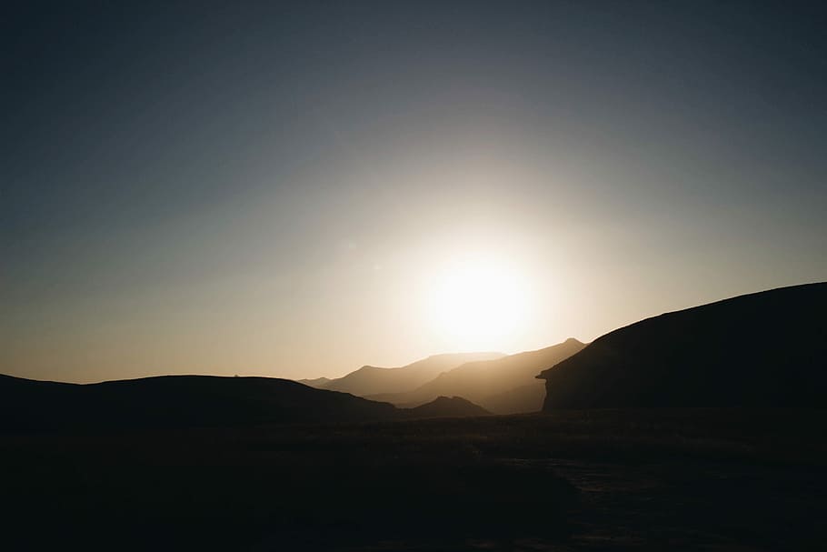 silhouette of mountain during sunrise, silhouette of mountains during daytime HD wallpaper