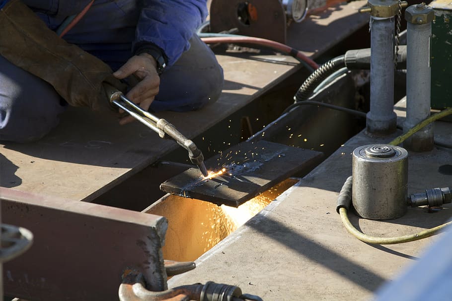 person holding black welding machine, welder, tool, worker HD wallpaper