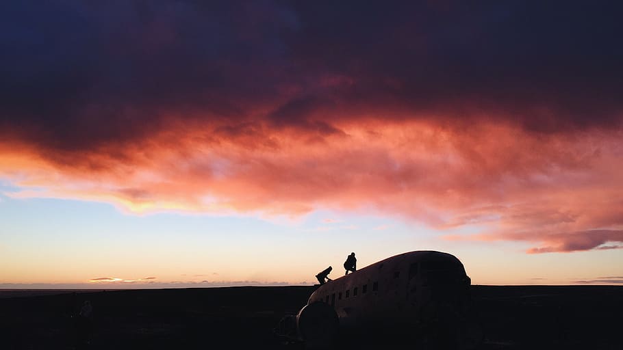 two person standing on white airplane, silhouette photography of two persons on top of airplane HD wallpaper