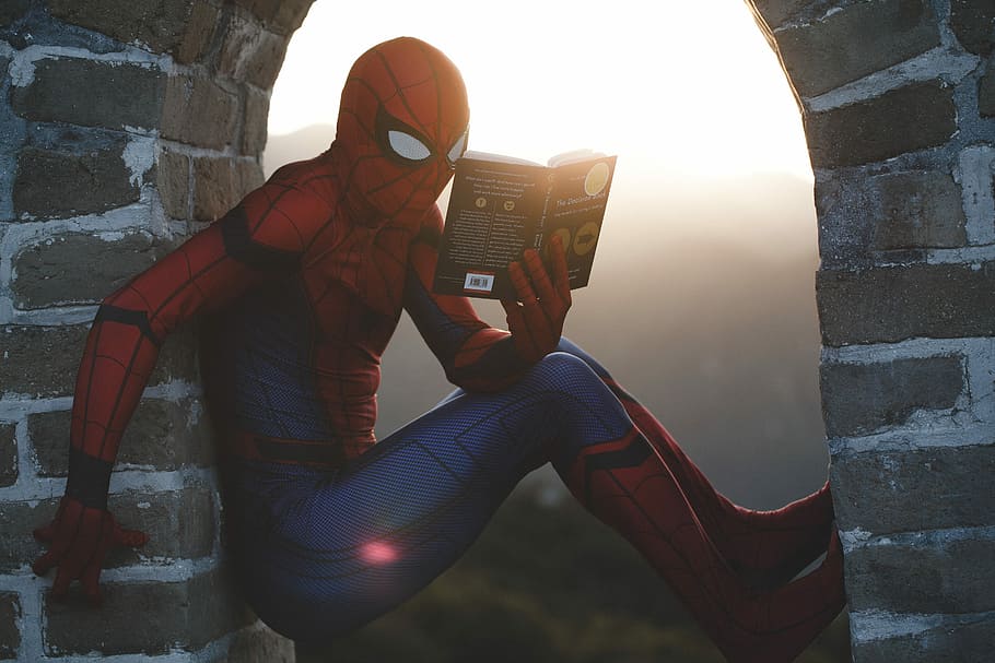 Spider-Man leaning on concrete brick while reading book, Spider-man reading book illustration