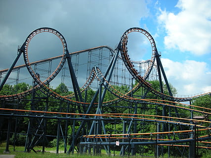 abandoned roller coaster surrounded by green trees at daytime HD wallpaper
