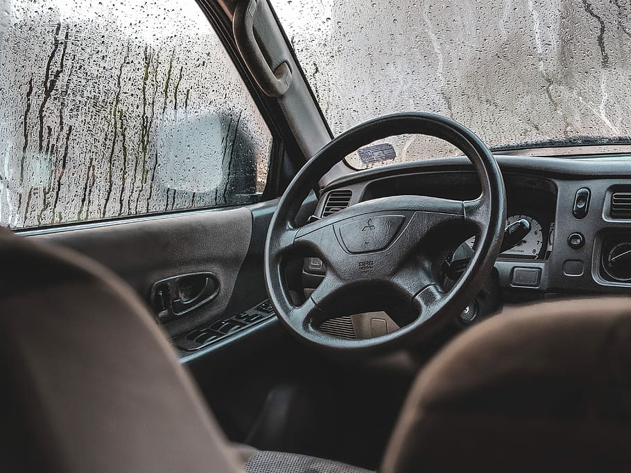 black Mitsubishi vehicle steering wheel, person taking photo of car interior HD wallpaper