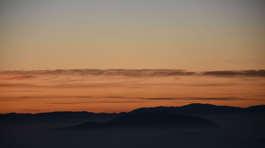 silhouette photography of mountain during golden hours, silhouette of mountain panoramic photography HD wallpaper