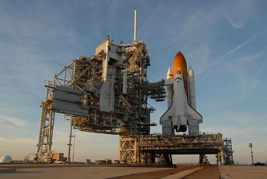 white and orange spaceship during daytime photo, atlantis space shuttle