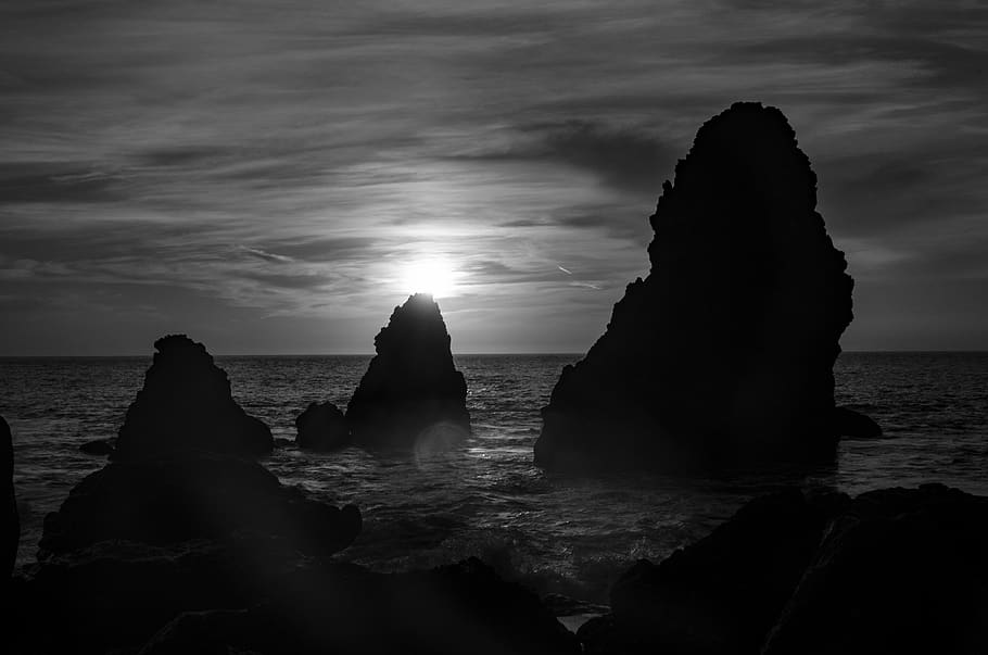 sunset, ocean, silhouette, backlight, sea, sky, water, rock HD wallpaper