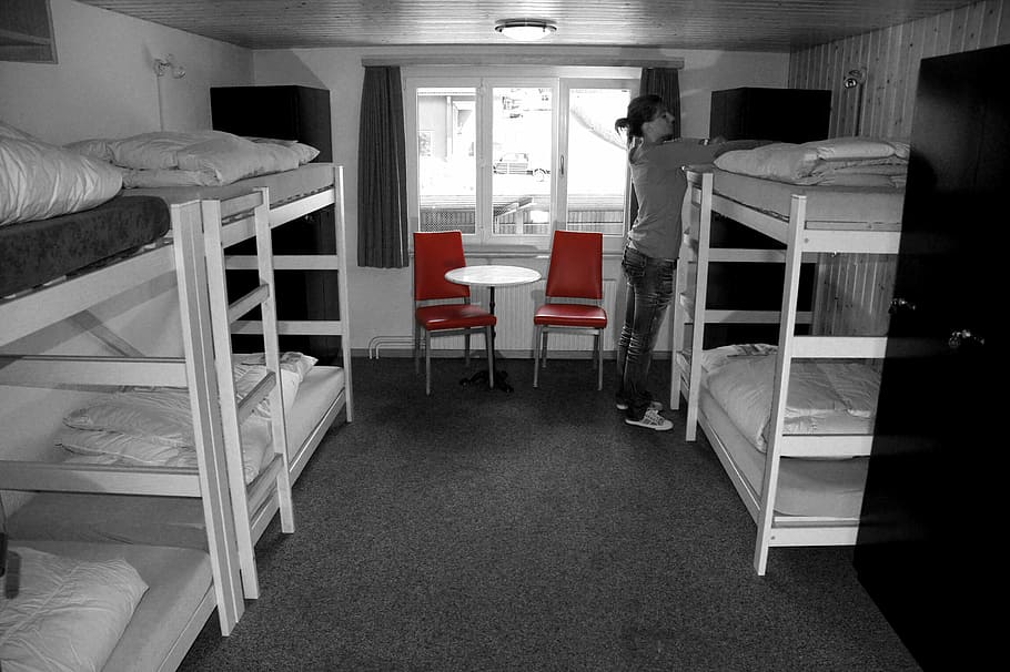 woman standing standing near wooden bunk bed, room, hostel, eiger north face