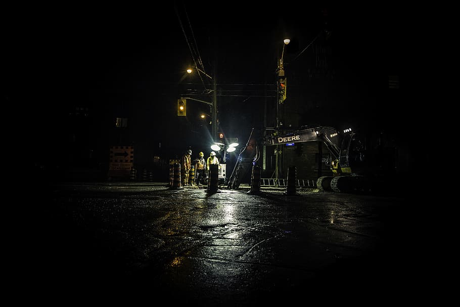 three people standing near utility post with lights turned on during nighttime, untitled HD wallpaper