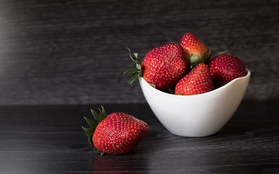 strawberries in jar while 1 is on black surface, red, ripe HD wallpaper