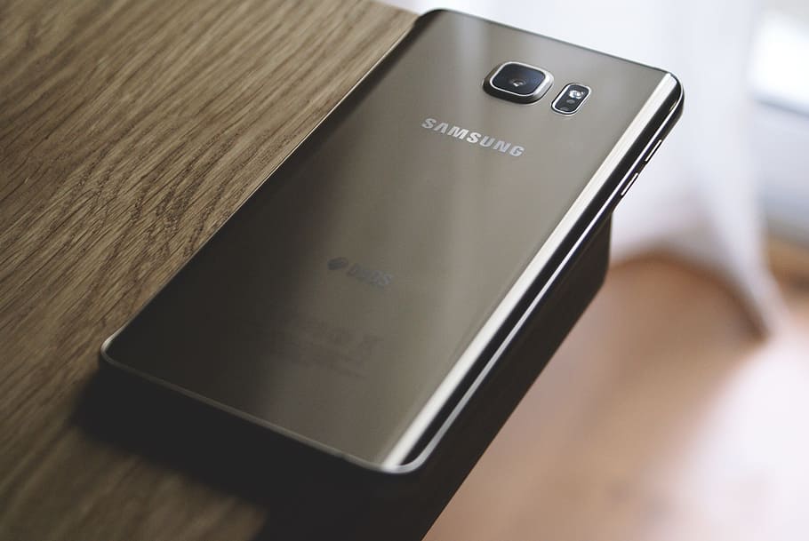 Samsung Galaxy smartphone on table edge, mobile, cellphone HD wallpaper