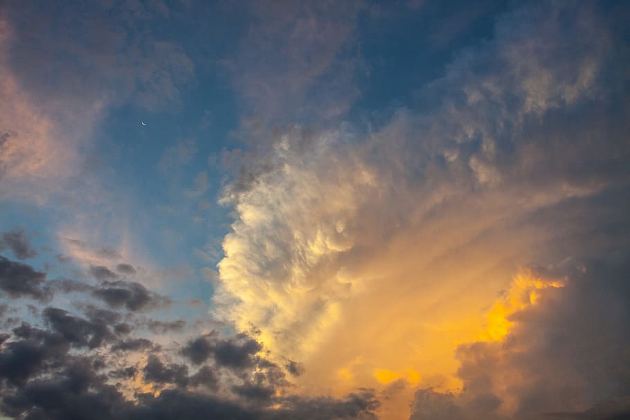 Wide-angle shot of a stormy cloud formation at sunset, image captured in Kent, England HD wallpaper