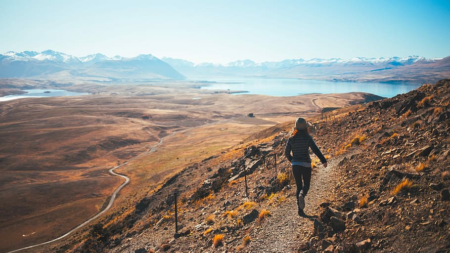 shallow focus photography of woman running, brown mountain, mountain path HD wallpaper