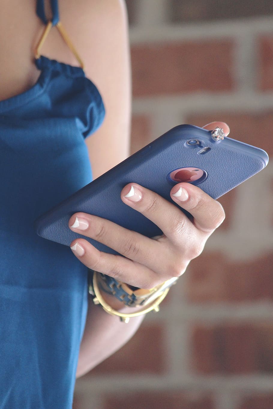 woman holding iPhone with blue case, using device, mobile, technology HD wallpaper