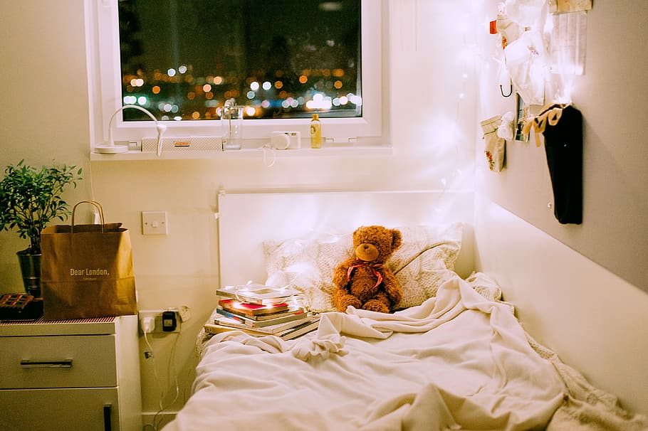 Brown Bear Plush Toy on White Bed Comforter Inside Lighted Bedroom HD wallpaper