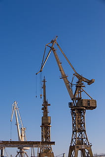 photo of white metal towers under clear blue sky at daytime HD wallpaper