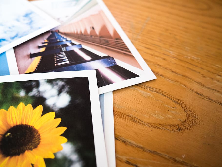 Photos on Desk, prints, subway, sunflower, wood, Macro, Objects