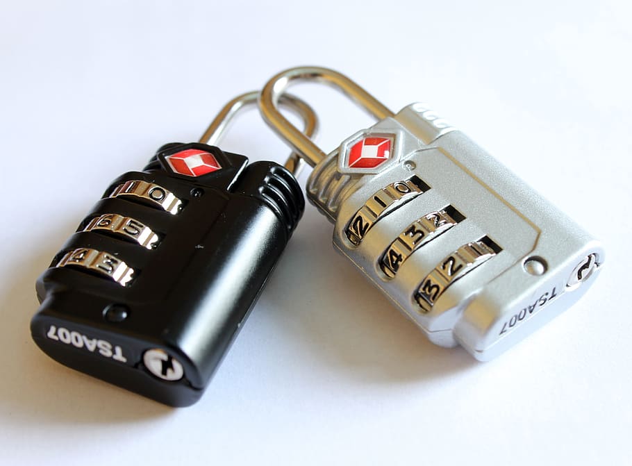 photography of black and gray combination padlocks, locks for bags