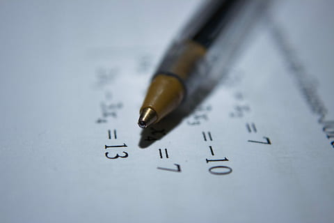 Pencil on system of equations, selective focus photography of black ball-point pen on top of paper with mathematical equations HD wallpaper