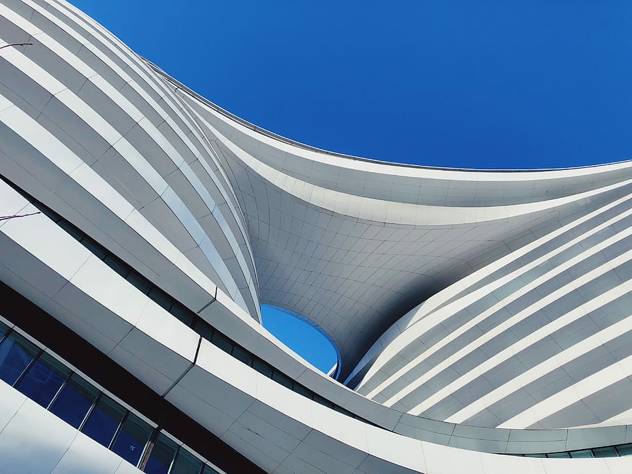 low angle photography of building under blue sky, structural photography of white high rise building HD wallpaper