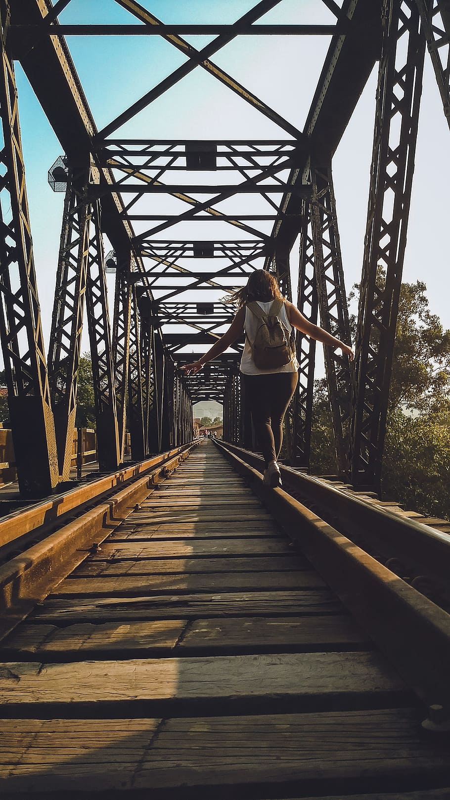 Woman Walking on a Train Rail, architecture, backpack, bridge HD wallpaper