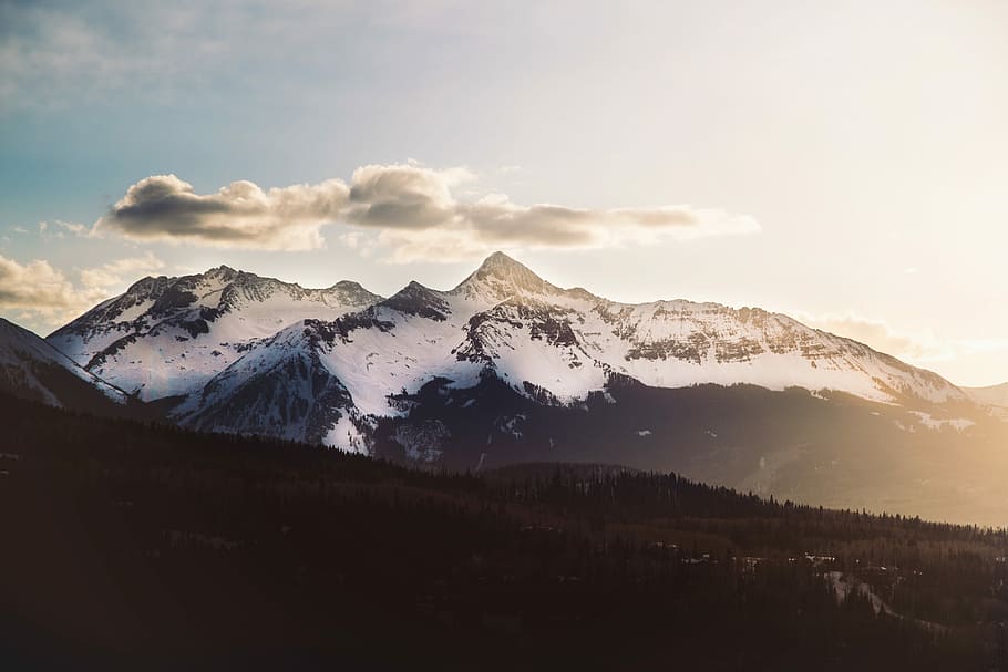 mountain covered with snow under white clouds during daytime, cloudy over alp mountain HD wallpaper