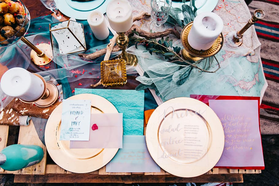 two gold-colored plates on brown wooden table, two white ceramic plates on brown wooden table HD wallpaper