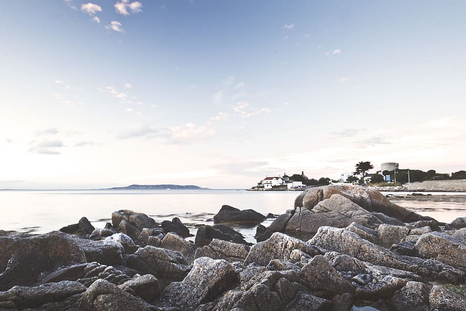 rock formation on seashore under blue sky during daytime, untitled HD wallpaper
