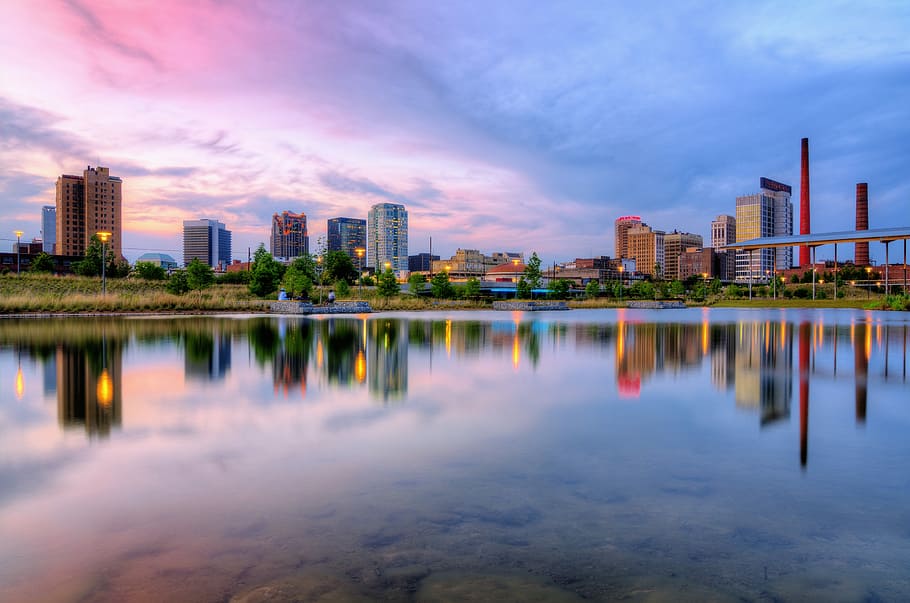 landscape photography of cityscape by water, city skyline during daytime HD wallpaper