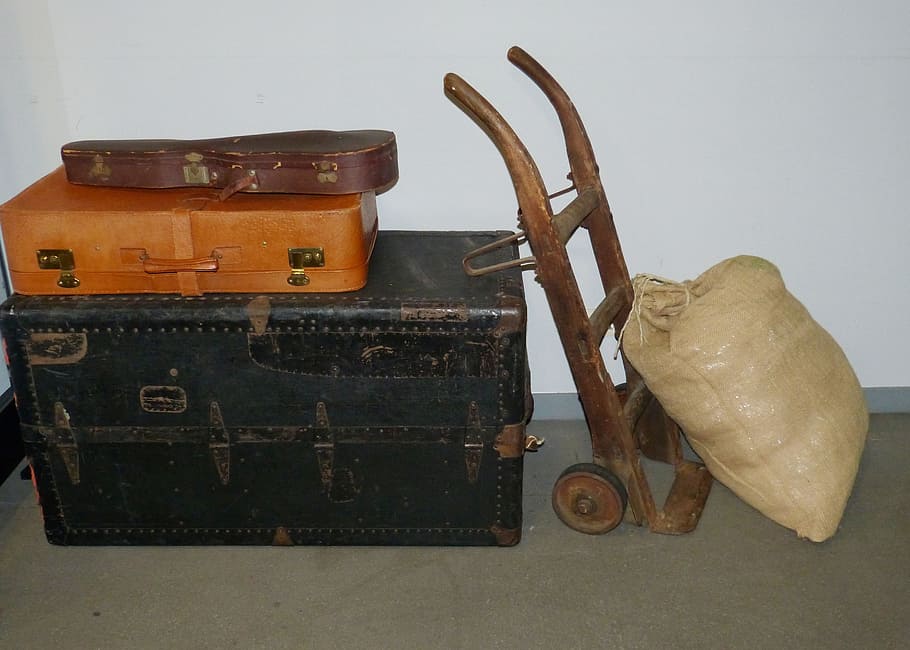 brown sack beside hand truck and storage boxes, Luggage, Cart