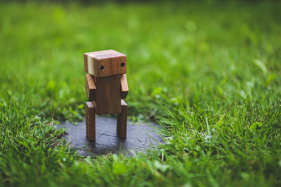brown wooden figurine, robot, grass, lawn, green, handmade HD wallpaper