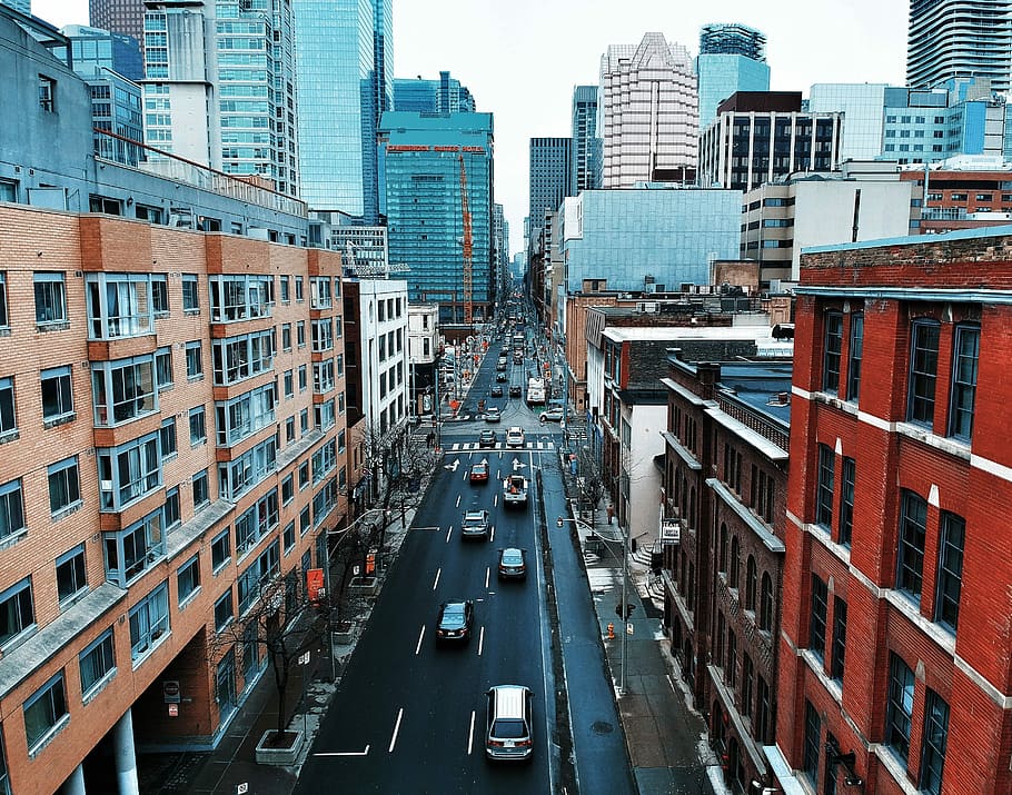 blue and red city buildings during day time, aerial photography of vehicles on road during daytime HD wallpaper