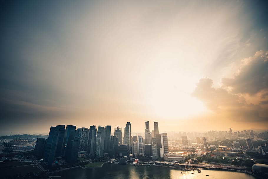 aerial view photography of highrise building under golden hour HD wallpaper