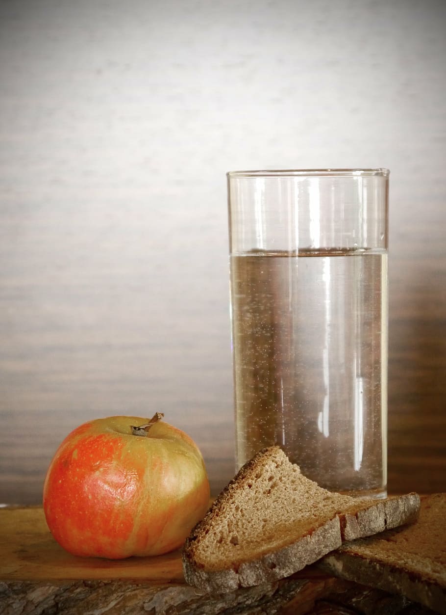 clear drinking glass beside red apple, bread, water, dry, eat HD wallpaper