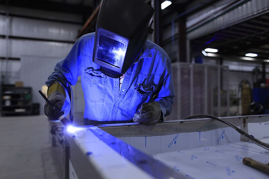 welder wearing helmet and blue uniform, welding, industry, industrial