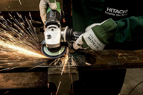 person using angle grinder on steel, hitachi, power tool, flexible HD wallpaper