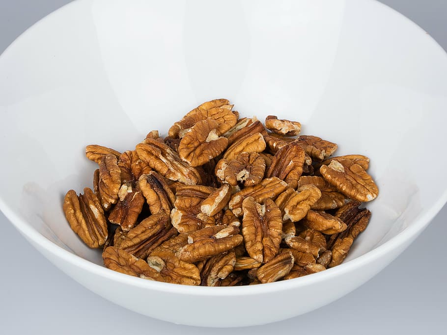pecan nuts on white ceramic bowl, isolated, vegetarian, natural HD wallpaper