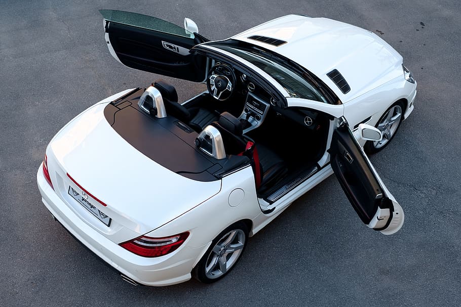 white BMW coupe with 2 doors open on gray pavement, car, mercedes