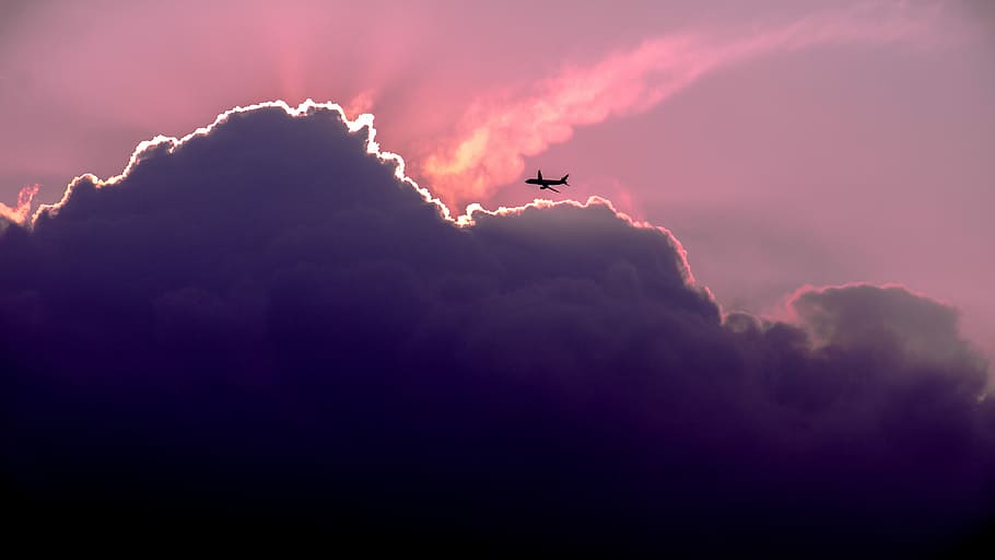 silhouette of airplanes of white clouds, passenger plane passing through clouds during sunset HD wallpaper
