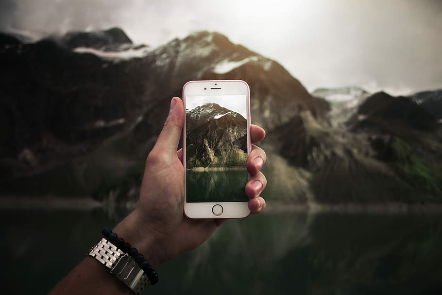 person taking photo on mountain, person taking photo of brown mountain HD wallpaper
