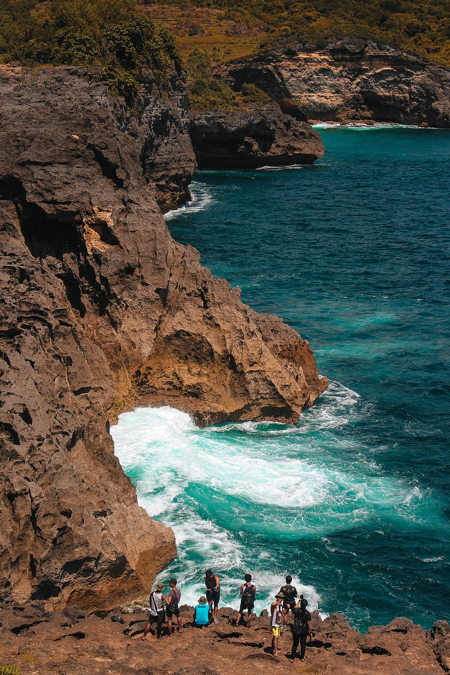 HD wallpaper: Lost in Nusa Penida, people on mountain cliff near body of water | Wallpaper Flare