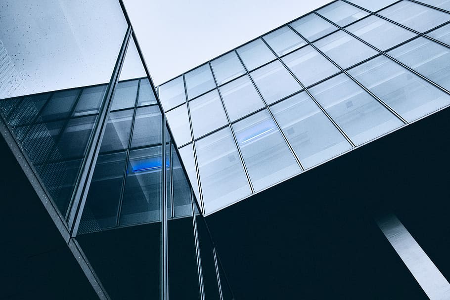 architectural photography of glass building, low-angle photo of gray concrete building HD wallpaper