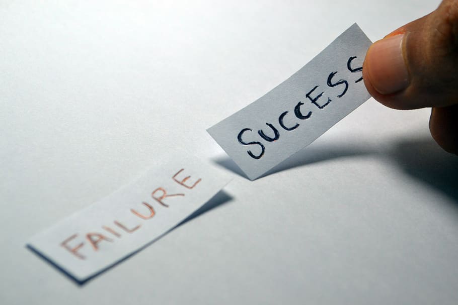 failure and success text showing in papers, opposite, choice