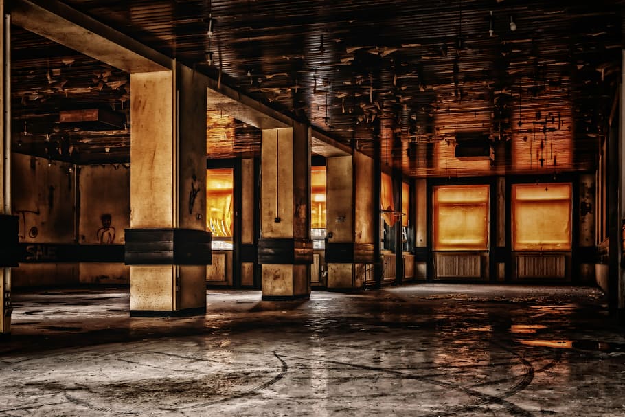 selective focus photography of concrete pillars, hall, space