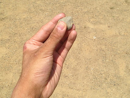 person holding brown rock, Hand, Nail, Stone, Sand, Sandpit HD wallpaper