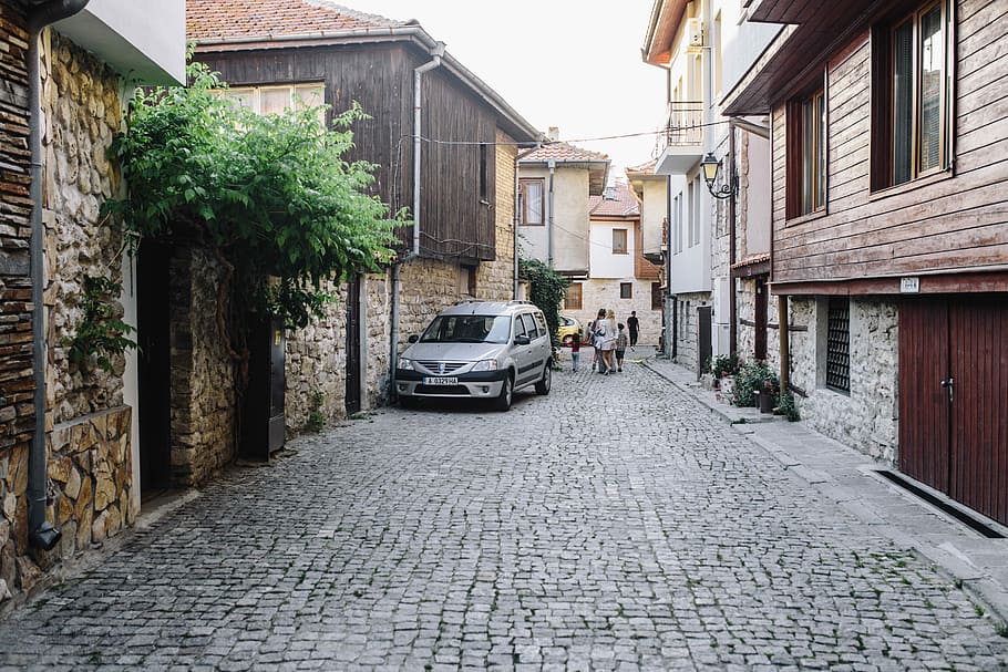 Narrow streets with old houses in the old town Nessebar, Bulgaria HD wallpaper