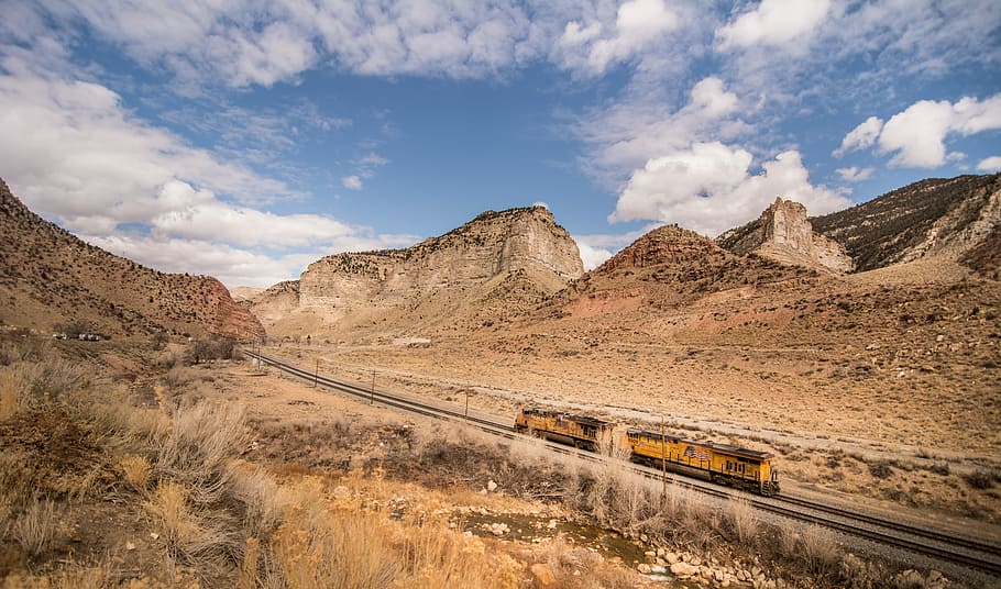 steel locomotive in railway traveling in between mountains, train on rail HD wallpaper