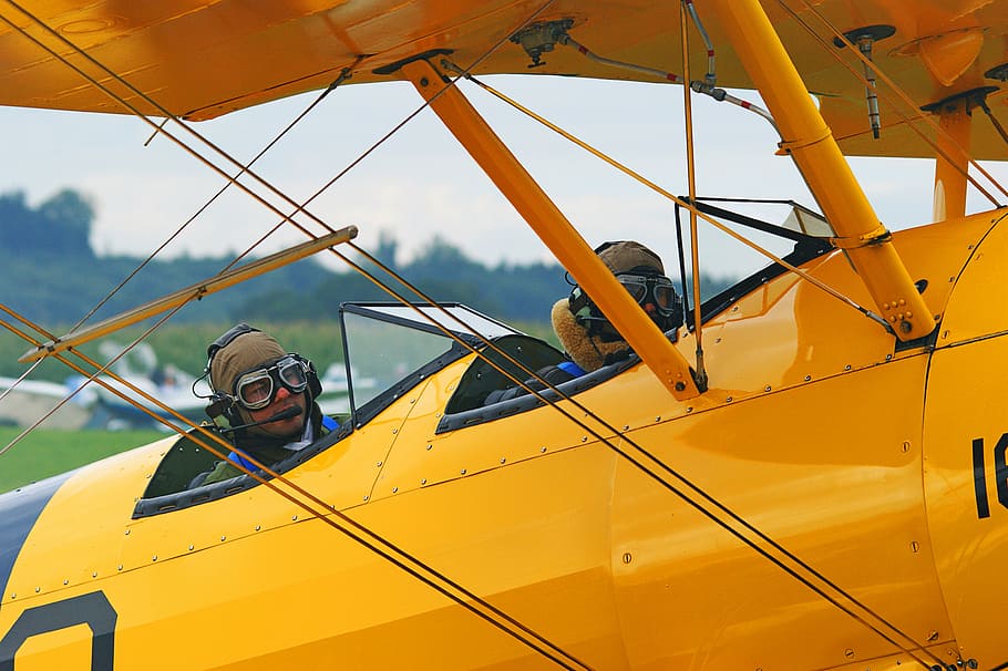 two men on yellow aircraft during daytime, oldtimer, take off HD wallpaper