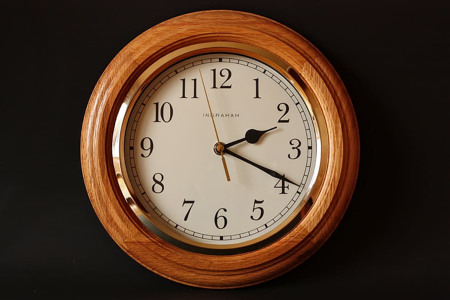 round brown analog wall clock on black surface, alarm clock, classic