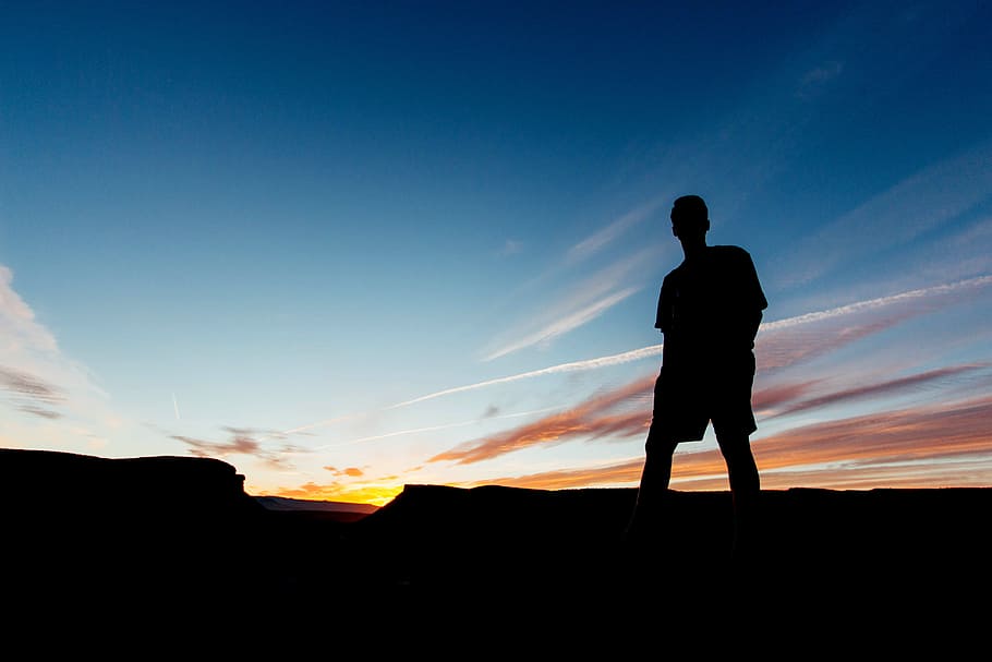 silhouette of man standing during sunset, silhouette of person standing under clear sky HD wallpaper