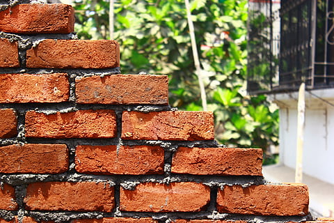 brown brick wall near white house close-up photography, Bricks HD wallpaper